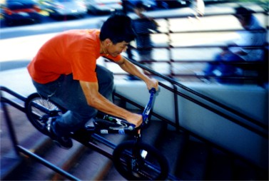 A woman mountain biking; Actual size=180 pixels wide